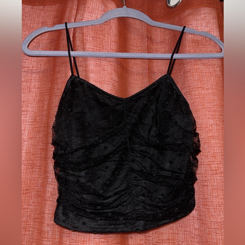 Black going out top